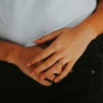 girl hands laying on the grass